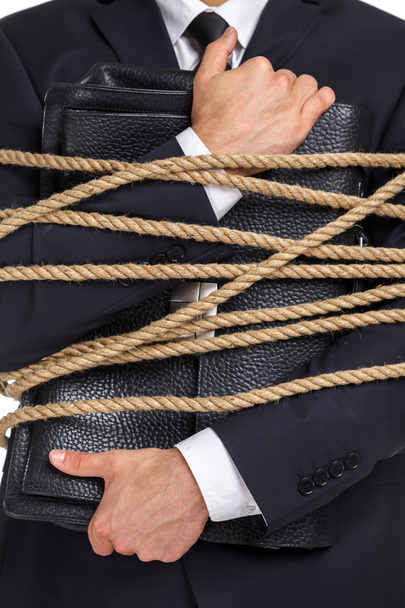 Close up of man handing briefcase tied with the rope - Foto, immagini