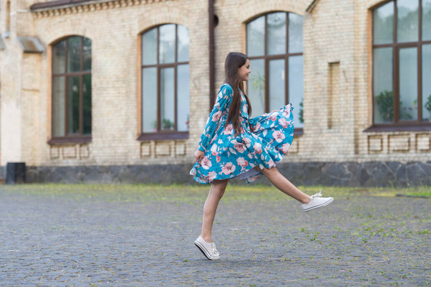 Girl summer dress flutters in motion urban background, freshness concept - Photo, Image