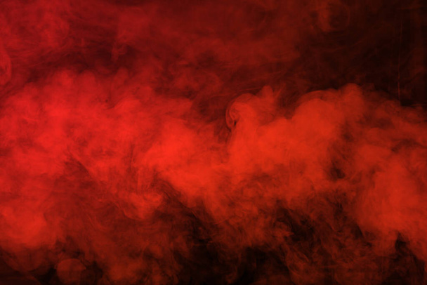 Red smoke on black background - Valokuva, kuva