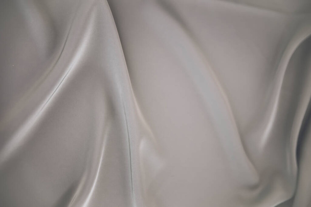 silk fabric with wavy holds in light grey color - Фото, зображення