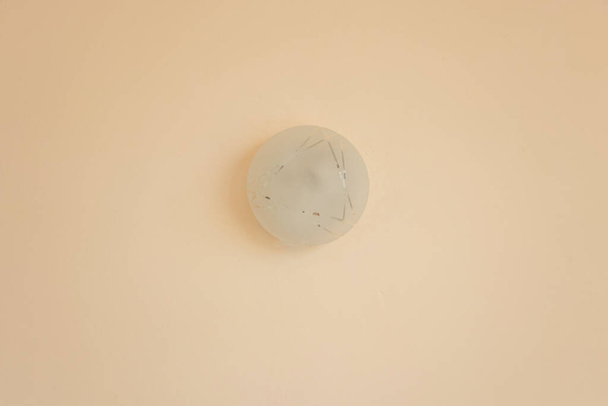 sconce round white having on the side light wall of the house - Фото, изображение