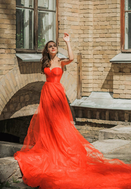Evening dresses concept, elegant fancy style. Woman in evening red dress. Clothes for ladies, inspiration  - Photo, Image
