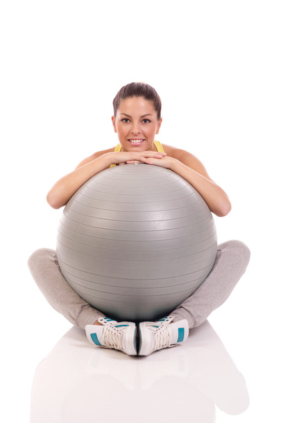 attractive woman exercising with exercise ball - Fotoğraf, Görsel