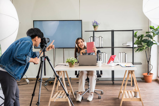 Behind the scene concept. Videographer setup before streaming live online content of beauty attractive Asian woman blogger podcaster with studio lighting. Influencer broadcasting vlogger, - Photo, Image