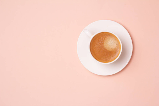 black coffee in a cup on a pink background top vie - Zdjęcie, obraz