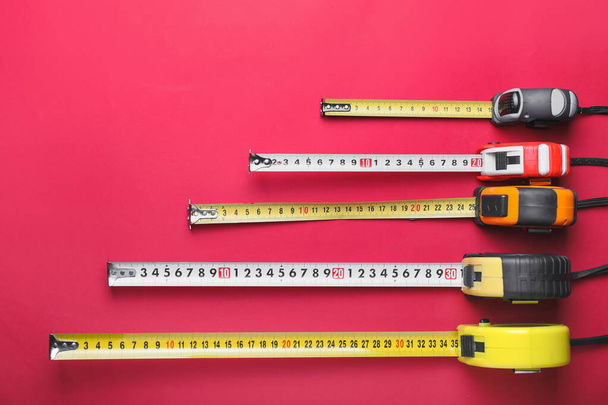 Measuring tapes on color background - Photo, Image