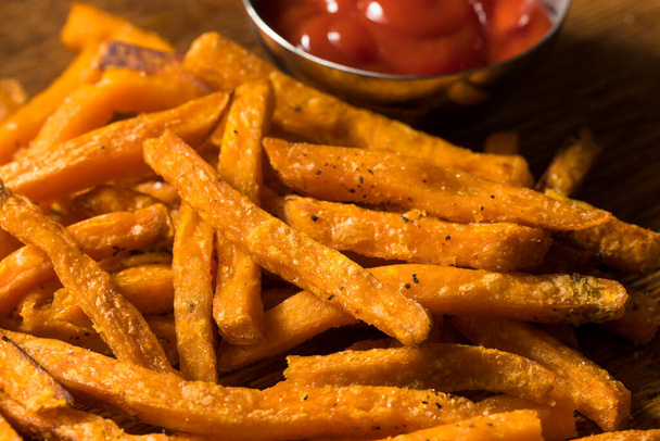 Homemade Sweet Potato French Fries with Salt and Pepper - 写真・画像