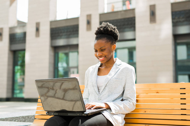 beautiful young african woman with laptop - Photo, Image