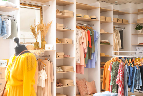 Stylish interior of modern clothes store - Zdjęcie, obraz
