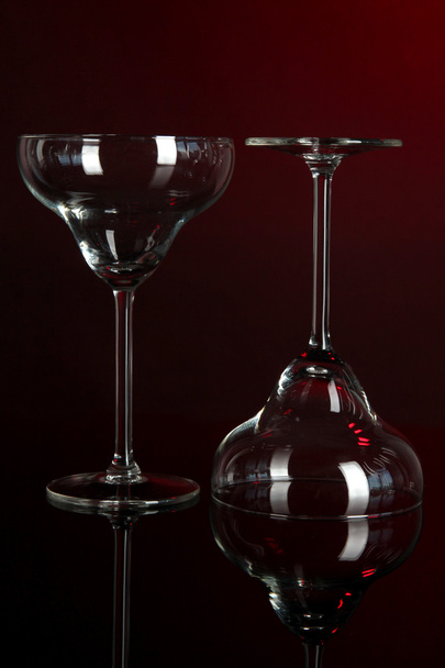 Two glasses on dark red background - Foto, Bild