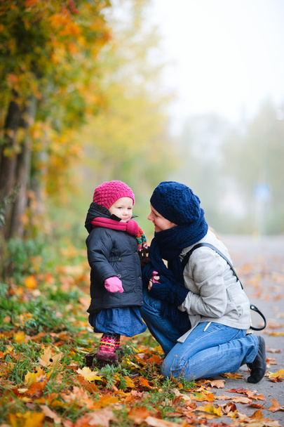 Mother and daughter outdoors on foggy day - Photo, image