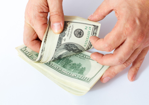 Businessman giving money cash dollars in hands - Photo, Image
