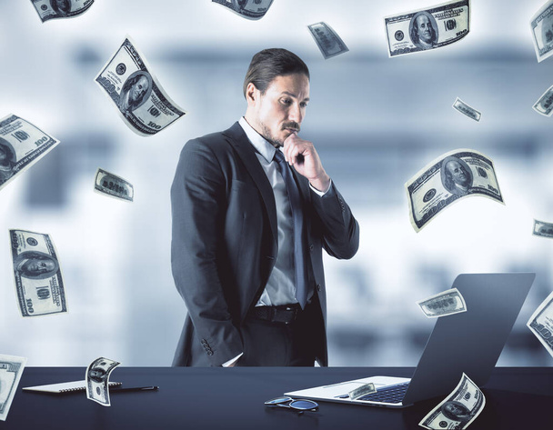 Businessman thinking and falling dollar bills. Business and financial success concept. - Фото, зображення
