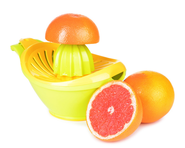 Citrus press and grapefruits isolated on white - Foto, imagen