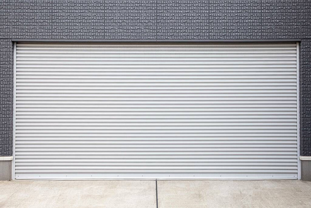 Automatic silver metal roller shutter doors on the ground floor of the house - Photo, Image