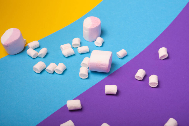 different types of marshmallows with different flavors on a bright colored background - Φωτογραφία, εικόνα