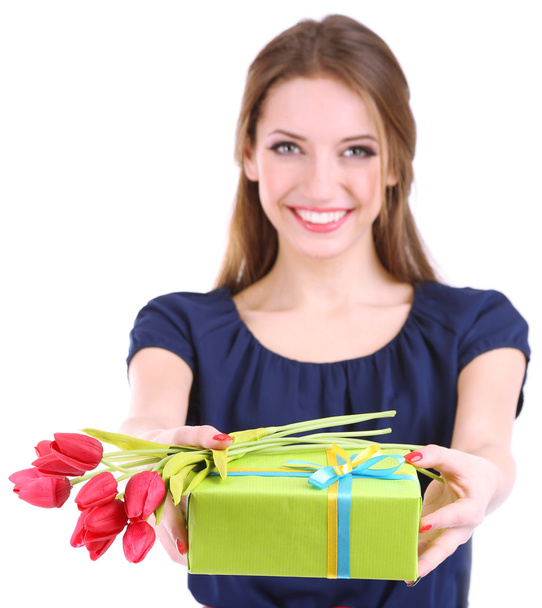 Attractive woman with gift box and flowers, isolated on white - Fotó, kép