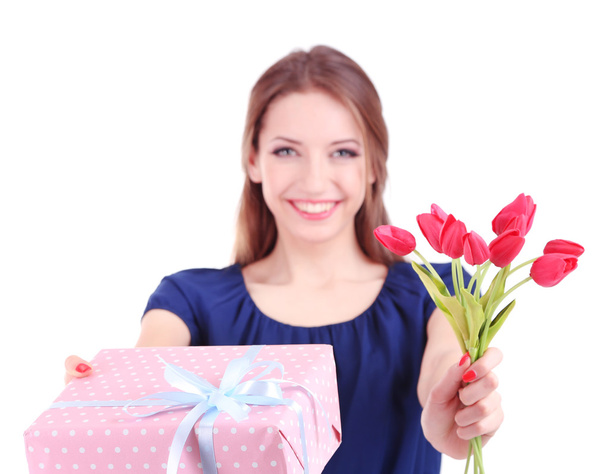 Attractive woman with gift box and flowers, isolated on white - Fotó, kép