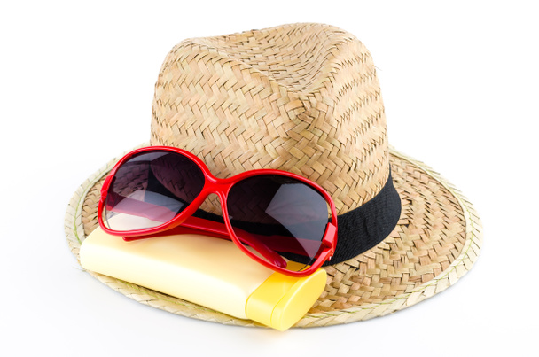 Sombrero, gafas de sol, loción corporal
 - Foto, imagen