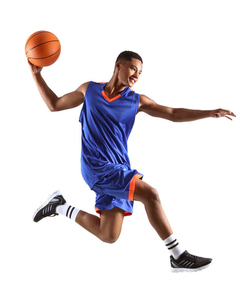 Jumping African-American basketball player on white background - Photo, Image