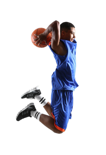 Jumping African-American basketball player on white background - Фото, зображення