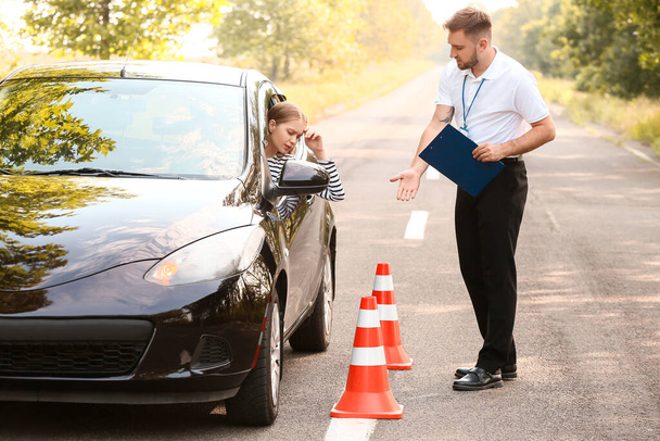 Instructor conducting driver licence test - Фото, изображение