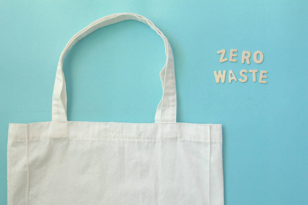 Cloth bag with zero waste on blue background. - Фото, зображення