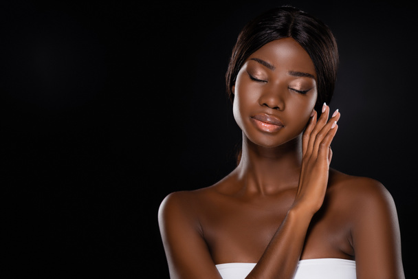 african american woman touching face with closed eyes isolated on black - Photo, Image