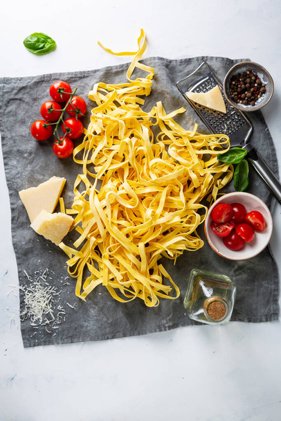 Raw fettuccini pasta and sauce ingredients - Fotografie, Obrázek
