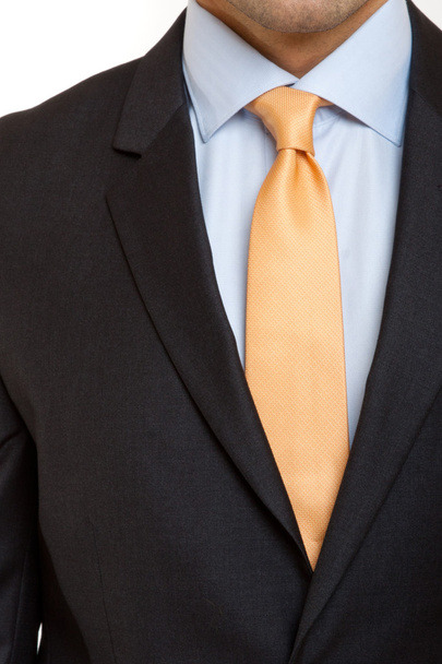 Traje negro con corbata naranja
 - Foto, Imagen