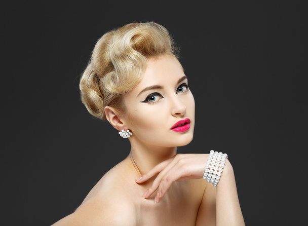 Beautiful young girl with jewels. Makeup in sixties style "arrow - Photo, Image