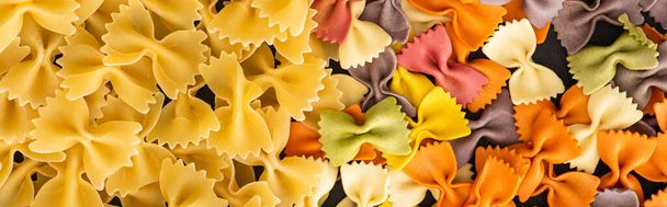 top view of raw colorful fusilli and farfalle pasta - 写真・画像