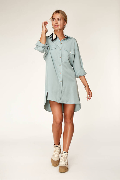 Beautiful sexy elegance woman skin tan body fashion model glamour pose wear trend casual clothes party summer blue long shirt dress collection makeup hair style blond success accessory studio. - Fotografie, Obrázek