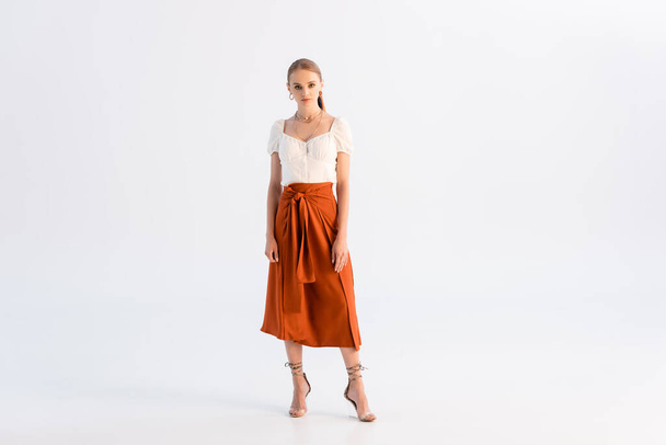 full length view of fashionable woman posing on white - Photo, Image