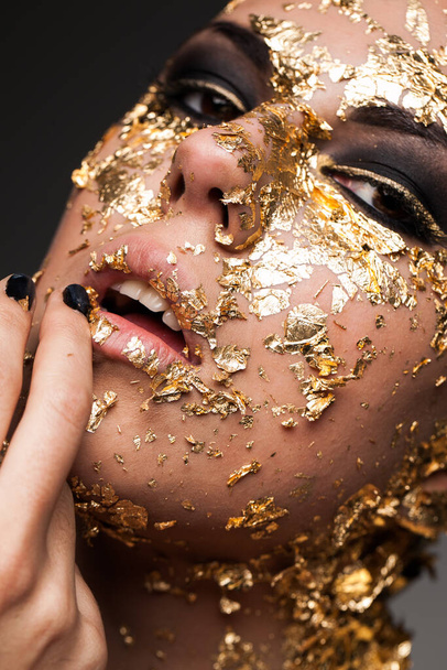 portrait of bold and naked woman with gold elements  - Valokuva, kuva