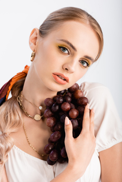rustic blonde woman posing with grapes isolated on white - Foto, immagini