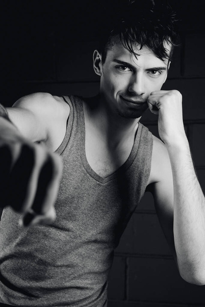 handsome model posing in boxing position in studio - Fotografie, Obrázek