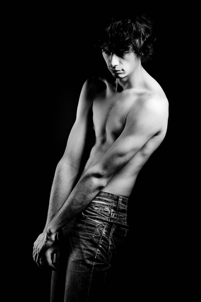 shirtless seductive handsome model posing in studio - Photo, image