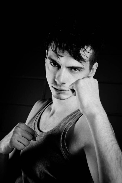 handsome model posing in boxing position in studio - 写真・画像