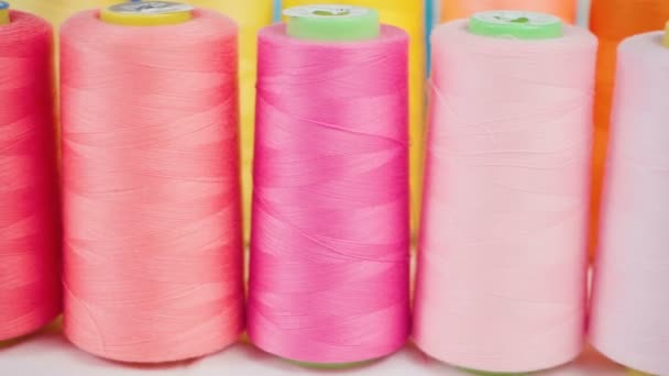 Video of pink spools of threads in workshop - Footage, Video