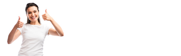 panoramic crop of young woman in white t-shirt showing thumbs up isolated on white - Foto, afbeelding