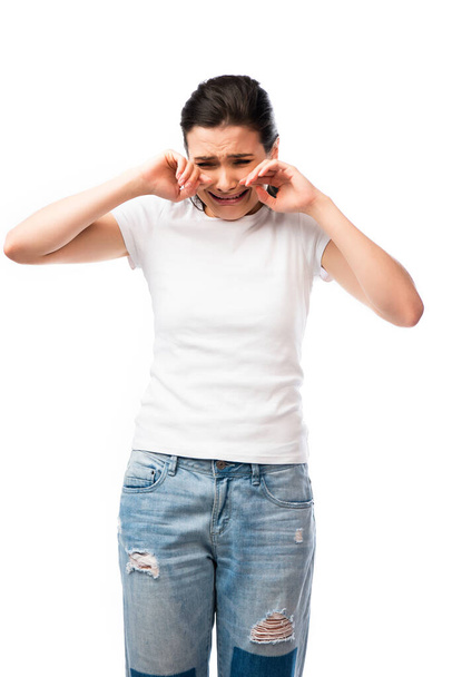 brunette woman in white t-shirt crying isolated on white  - Foto, immagini