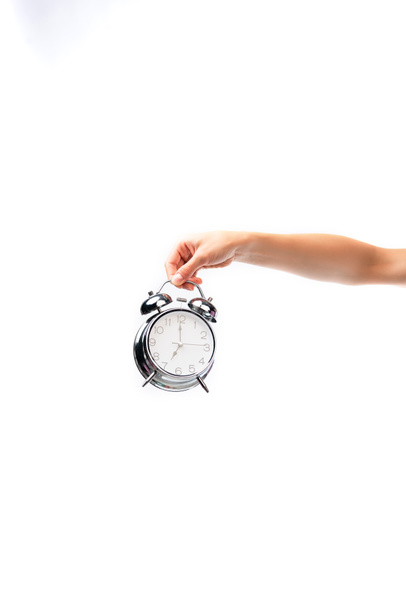 partial view of woman holding vintage alarm clock isolated on white - Photo, Image