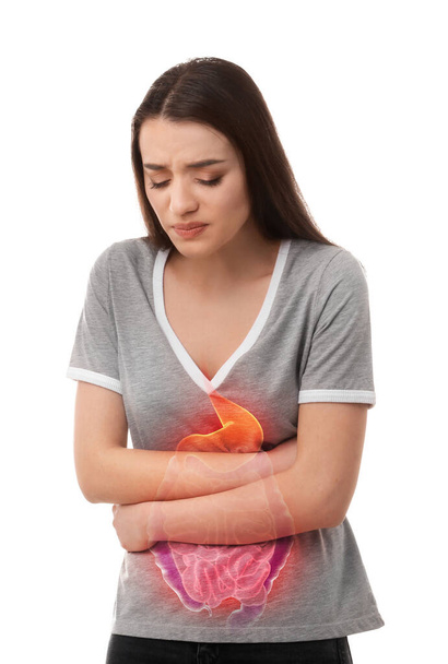 Young woman suffering from abdominal pain on white background - Foto, imagen