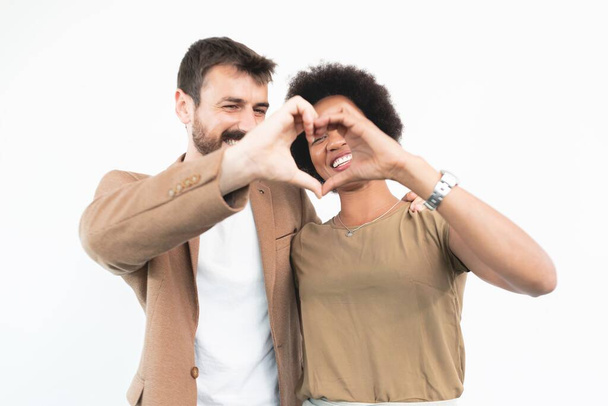 Romantic couple making heart shape with hands - Foto, immagini