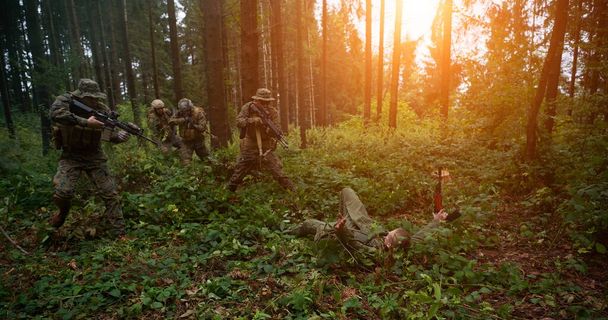 modern warfare marines capture alive terrorist   soldier in forest raid - Fotó, kép