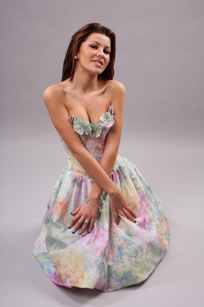 Attractive girl in colorful dress - Valokuva, kuva