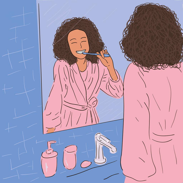Afroamerikanerin beim Zähneputzen im Badezimmer, in einem rosafarbenen Gewand vor dem Spiegel. Zahnpflege, Körperpflege. Archivbild. - Vektor, Bild