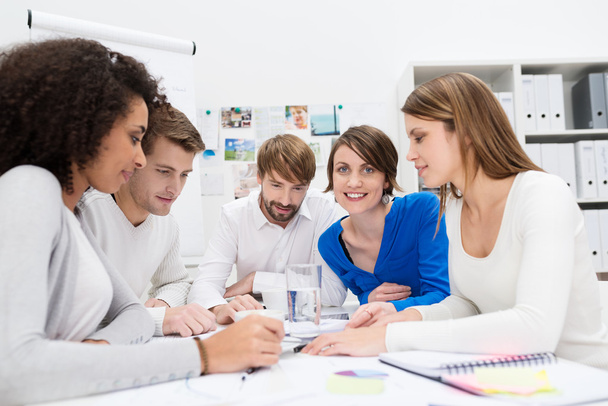 Dedicated young business team in a meeting - Фото, изображение
