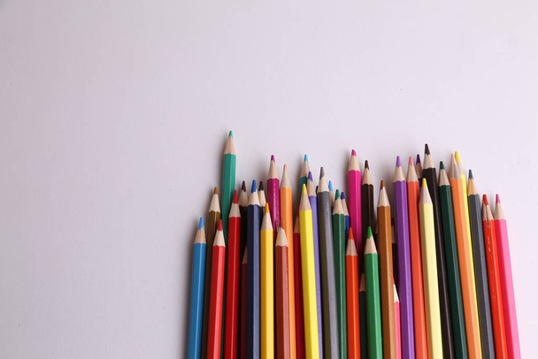 A closeup shot of colorful pencils on a white background - Fotoğraf, Görsel